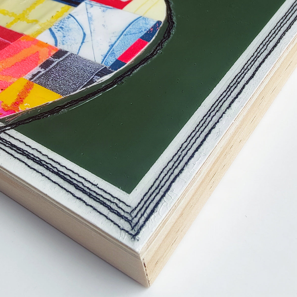 Wood panel edge detail with machine stitching