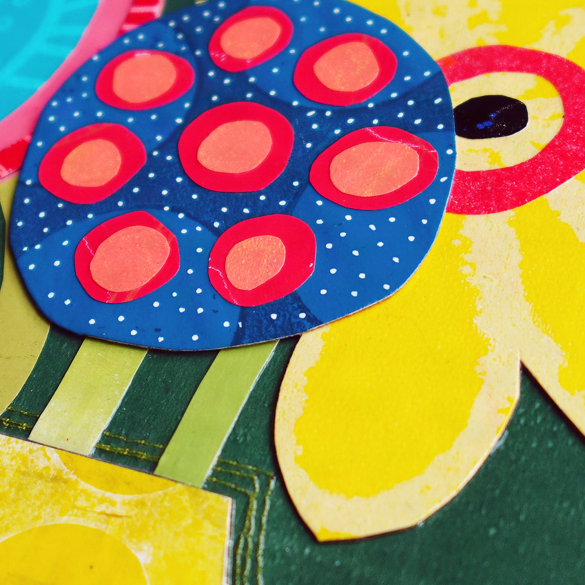 Close up detail image of colorful abstract flowers in blue, red, and yellow