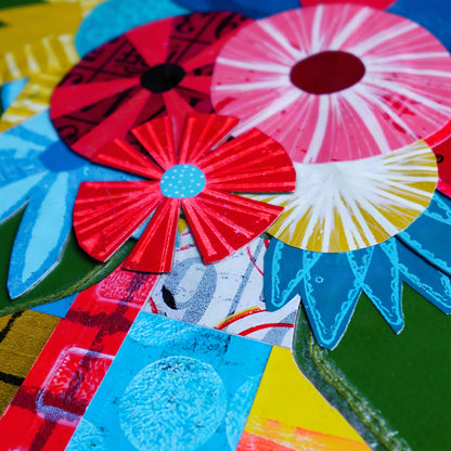 Close up image on colorful, abstract flowers in reds, yellow, and blues on dark green background.